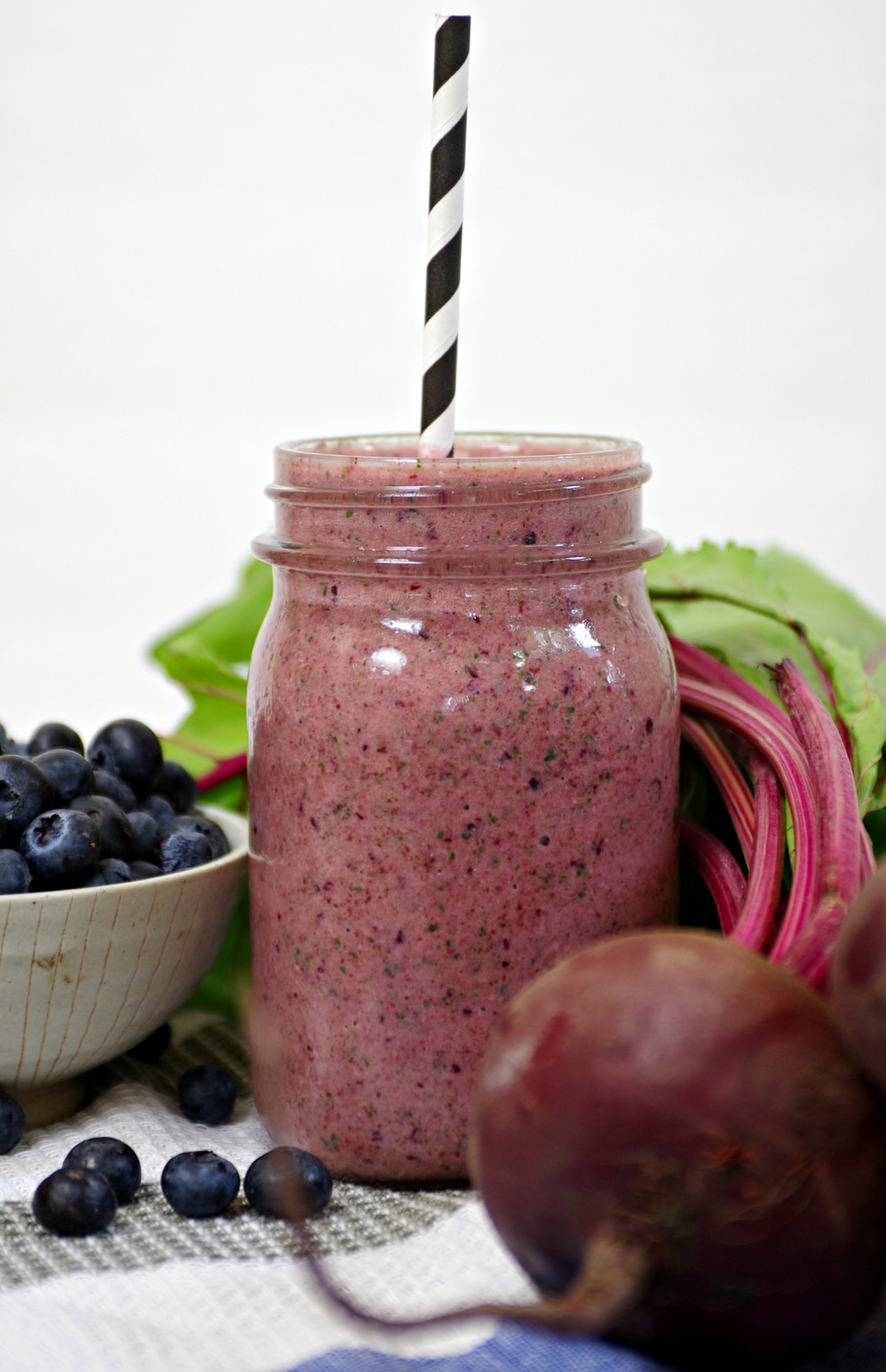 mason jar filled with Blueberry, Beet and Spinach Smoothie