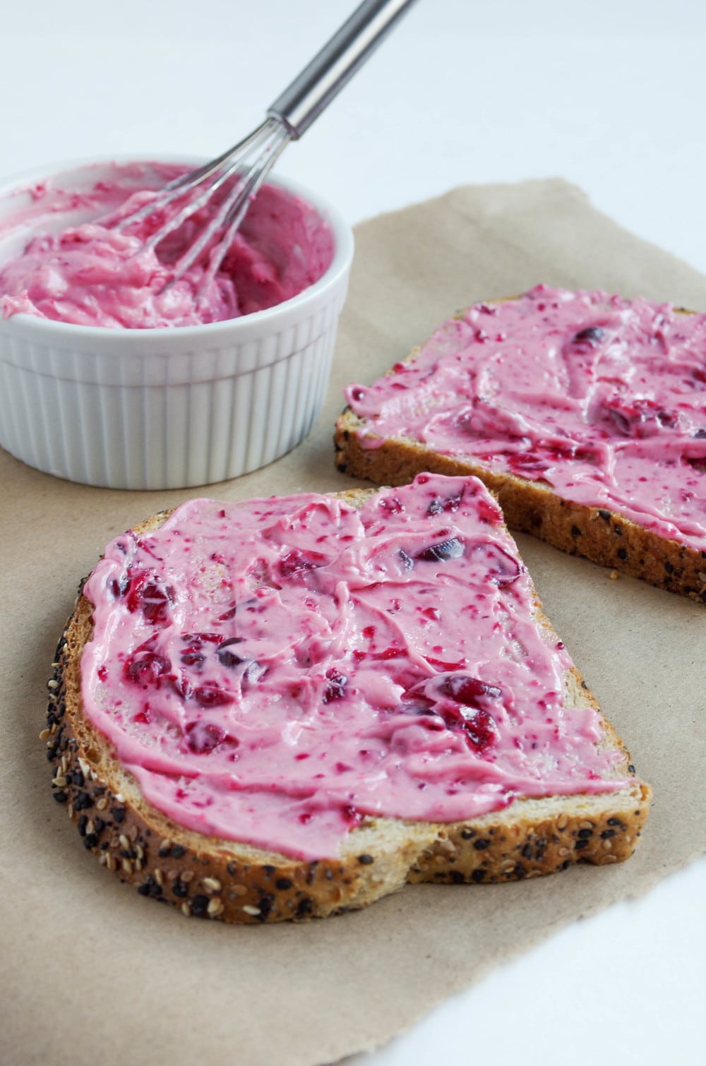 Cranberry Mayo in white bowl and spread on two pieces of bread