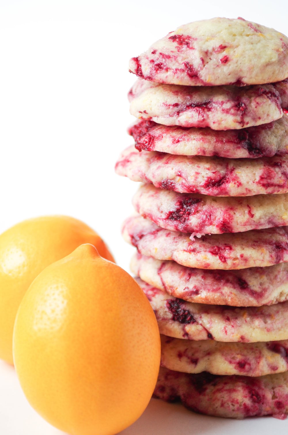 10 Raspberry Lemon Cookies stacked on top of one another