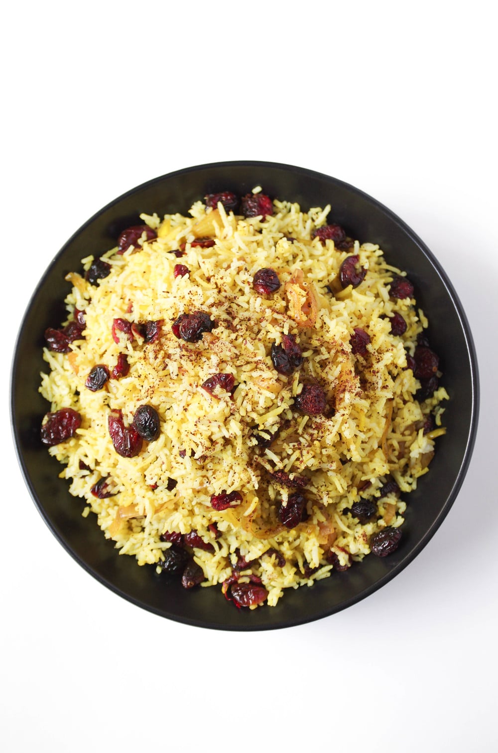 A close up of a plate of Persian cranberry rice pilaf