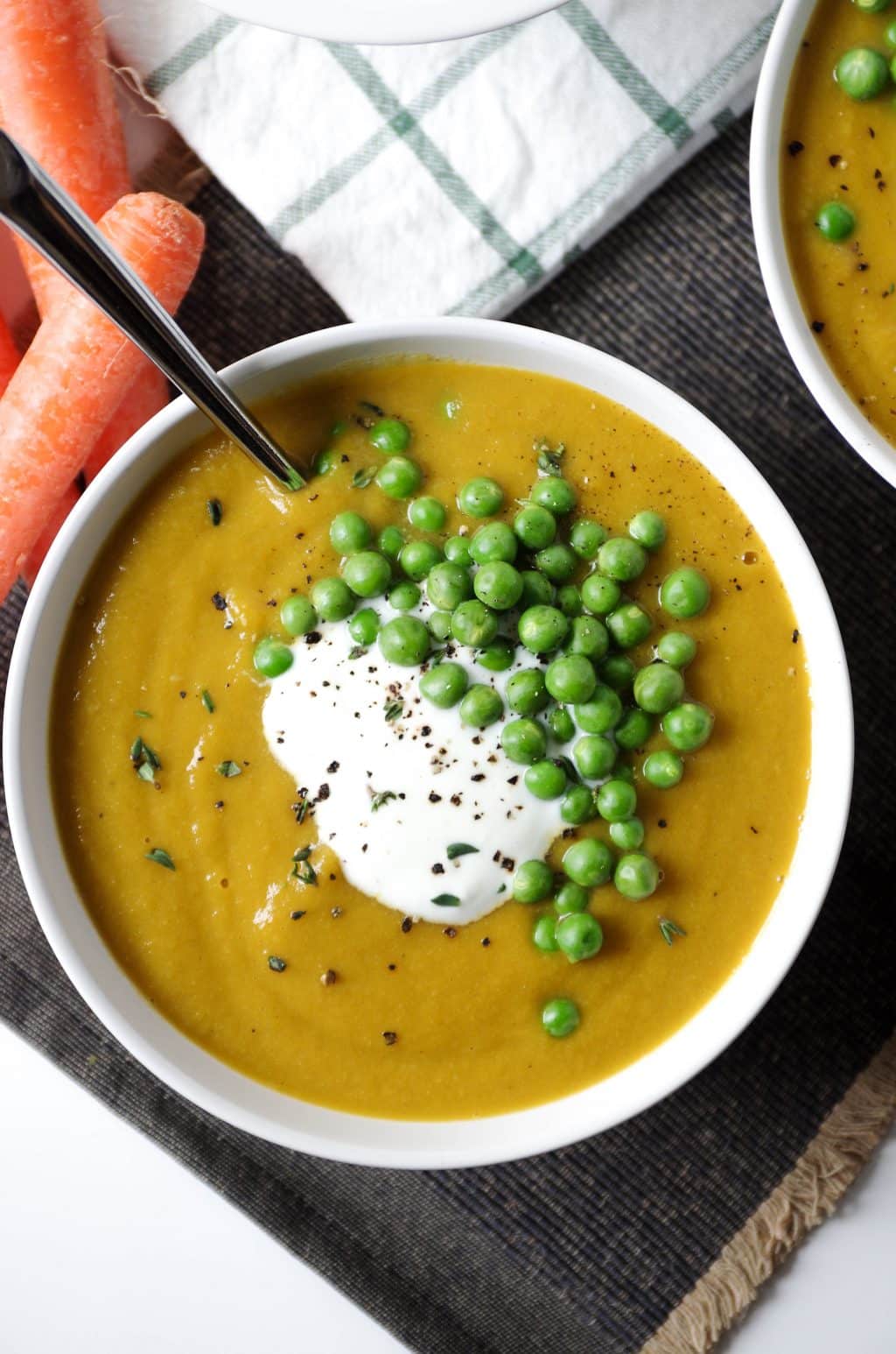 close up of bowl filled with Carrot Pea Soup