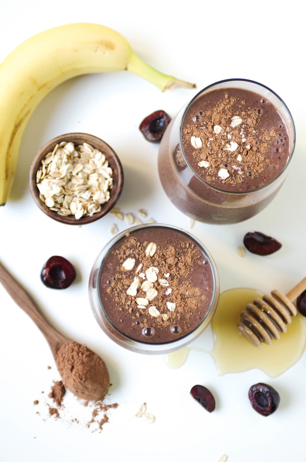 overhead image of Chocolate Cherry Smoothie with ingredients scattered