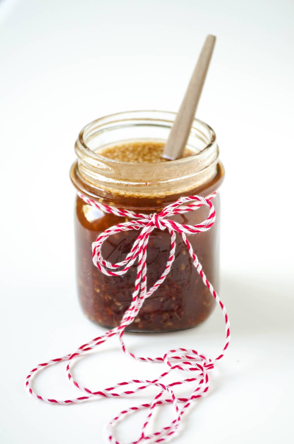 Sesame Ginger Dressing in mason jar wrapped in string