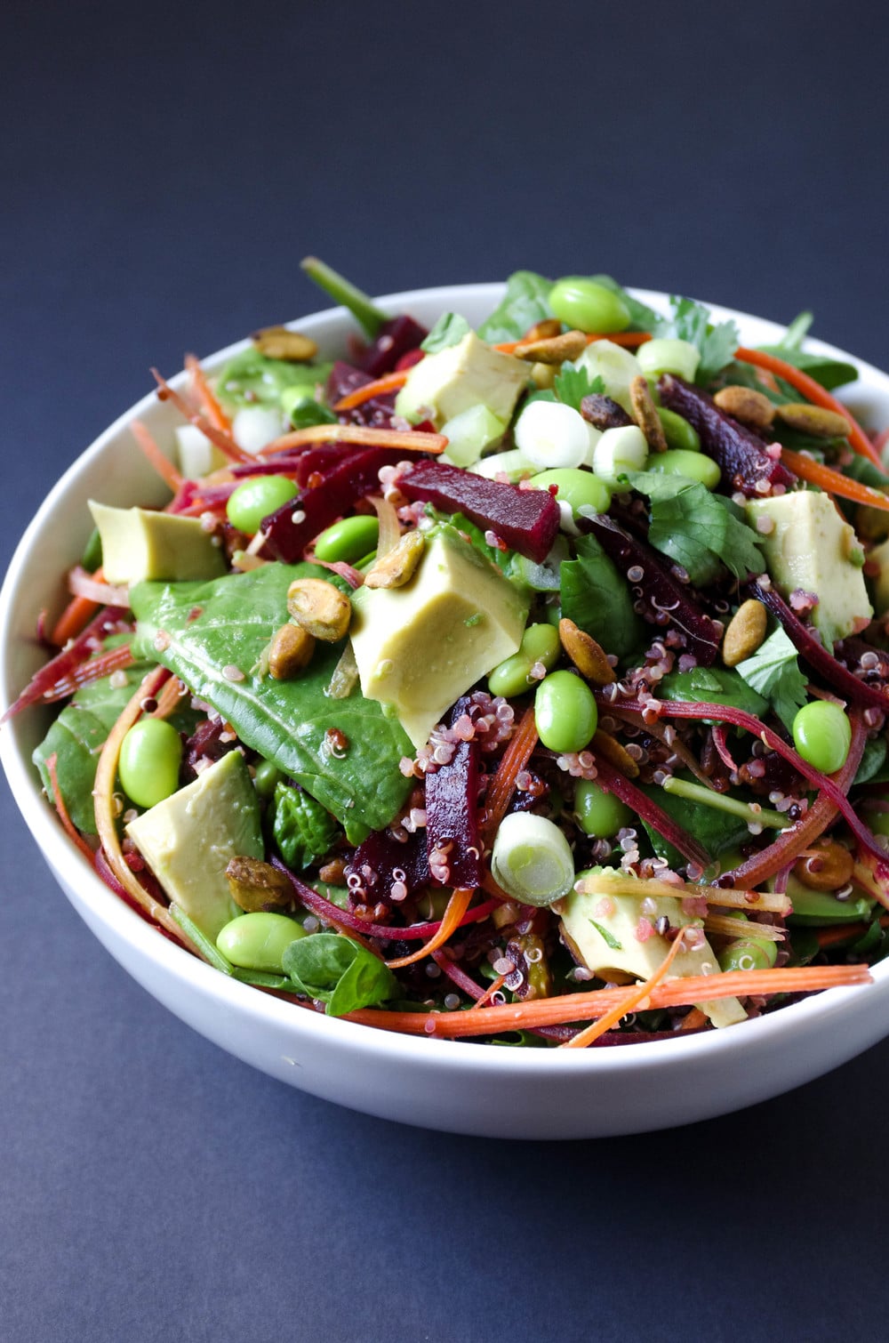 Quinoa Beet Salad in white bowl with Herb Vinaigrette