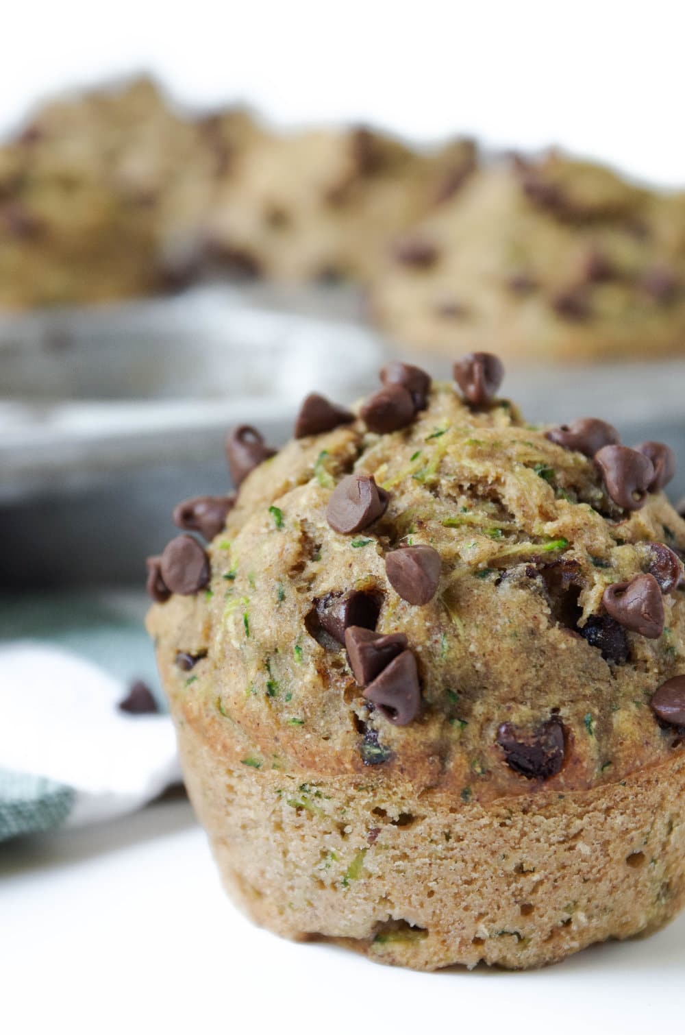 close up of single Healthy Zucchini Chocolate Chip Muffin