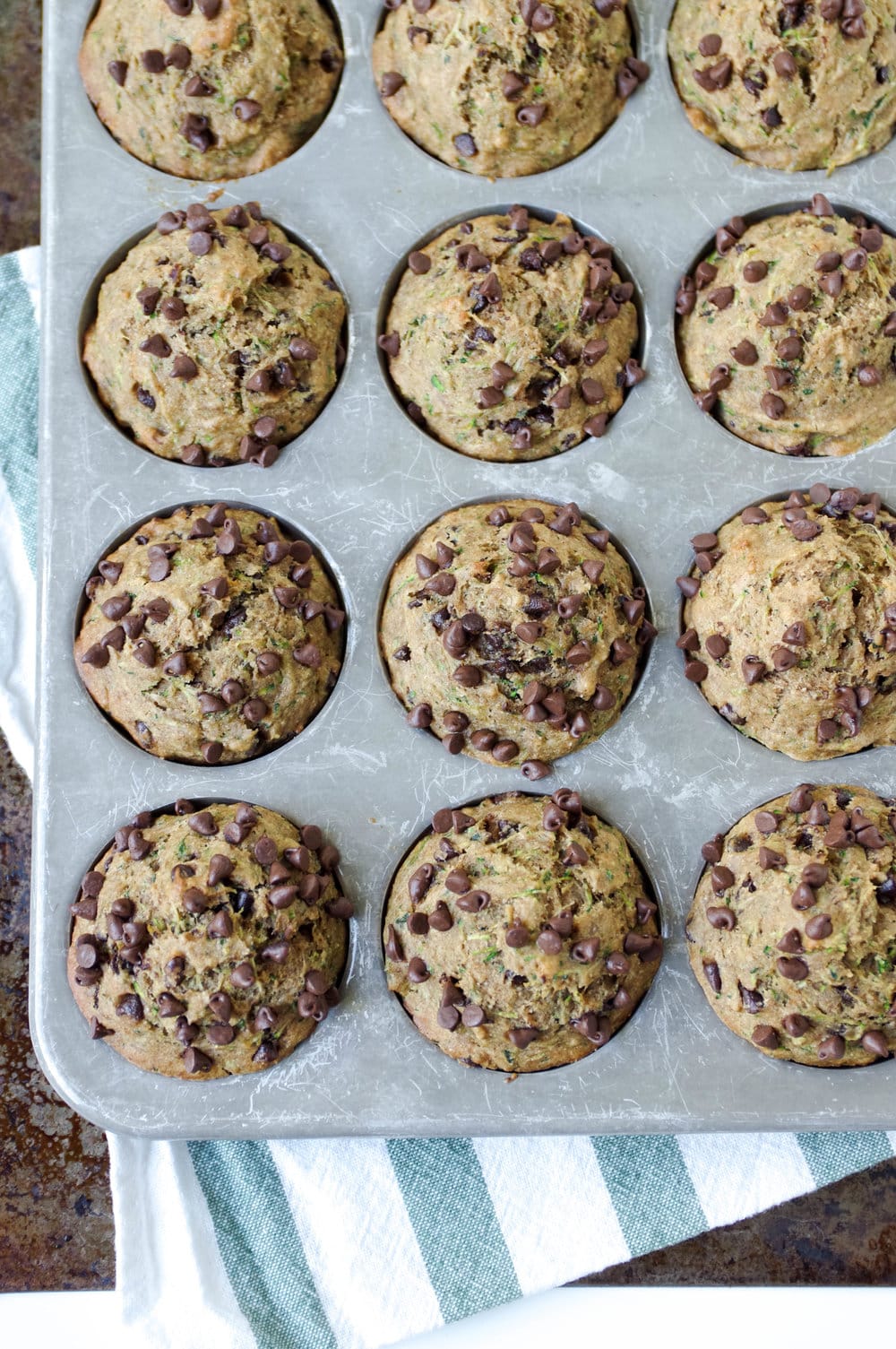 muffin pan filled with Healthy Zucchini Chocolate Chip Muffins