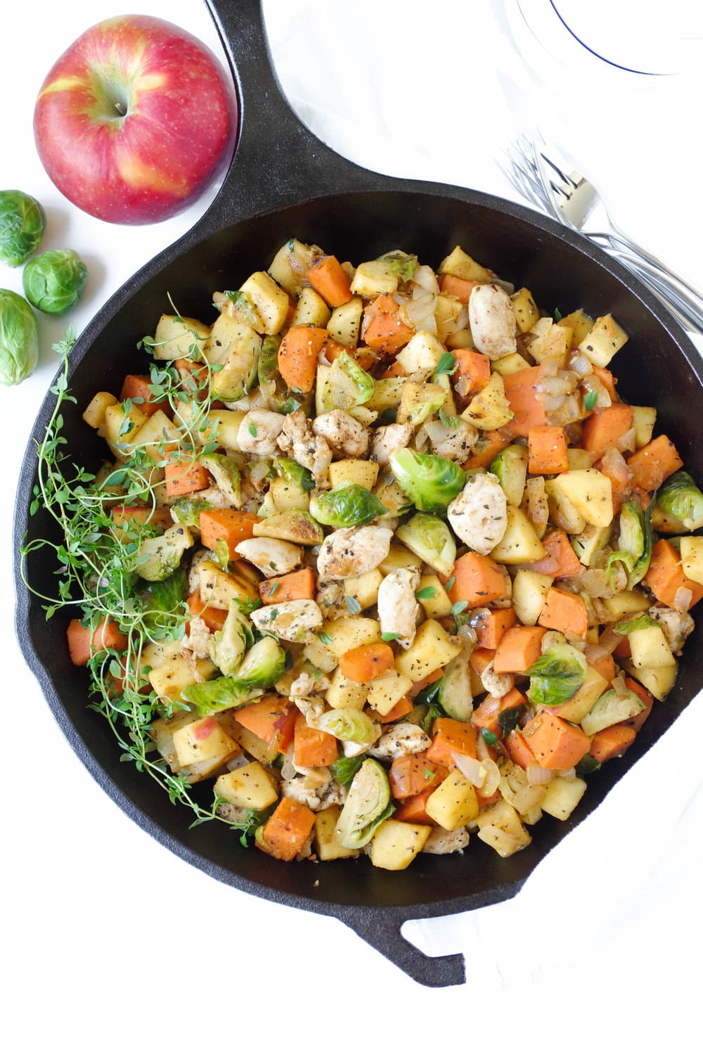 Chicken and Sweet Potatoes in a black cast iron skillet