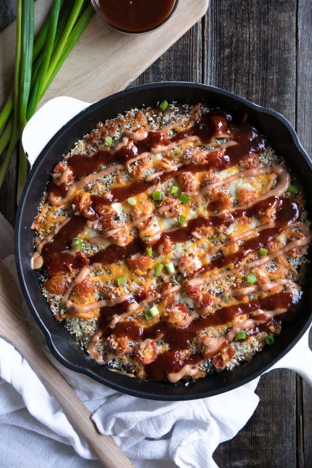 A skillet of bbq chicken spaghetti squash casserole on a table