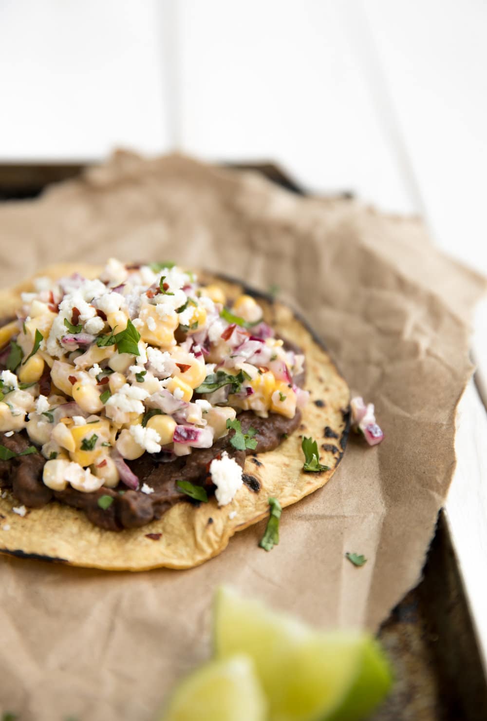 A close up of Mexican street corn tostadas 