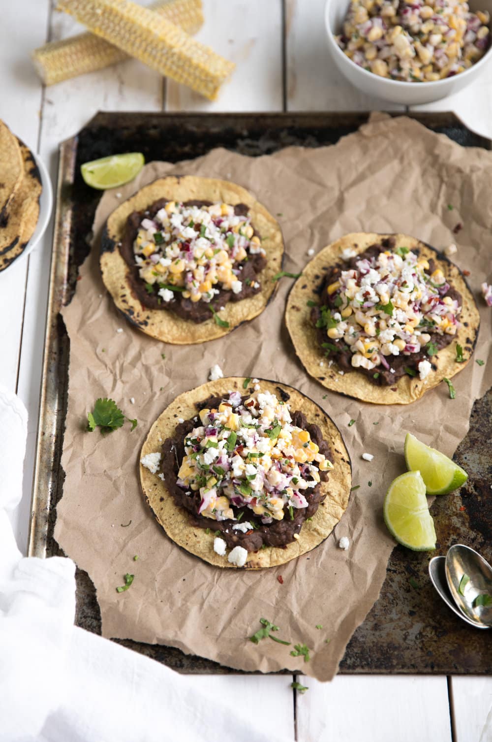 3 Mexican Street Corn Tostadas with Chipotle Black Beans on sheetpan