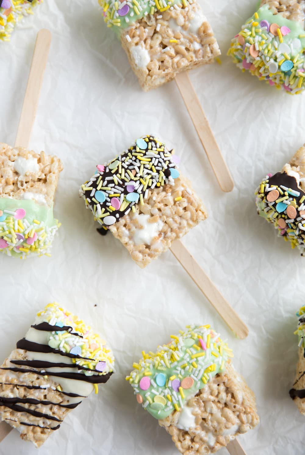 Chocolate Dipped Easter Rice Krispie Treats on parchment paper