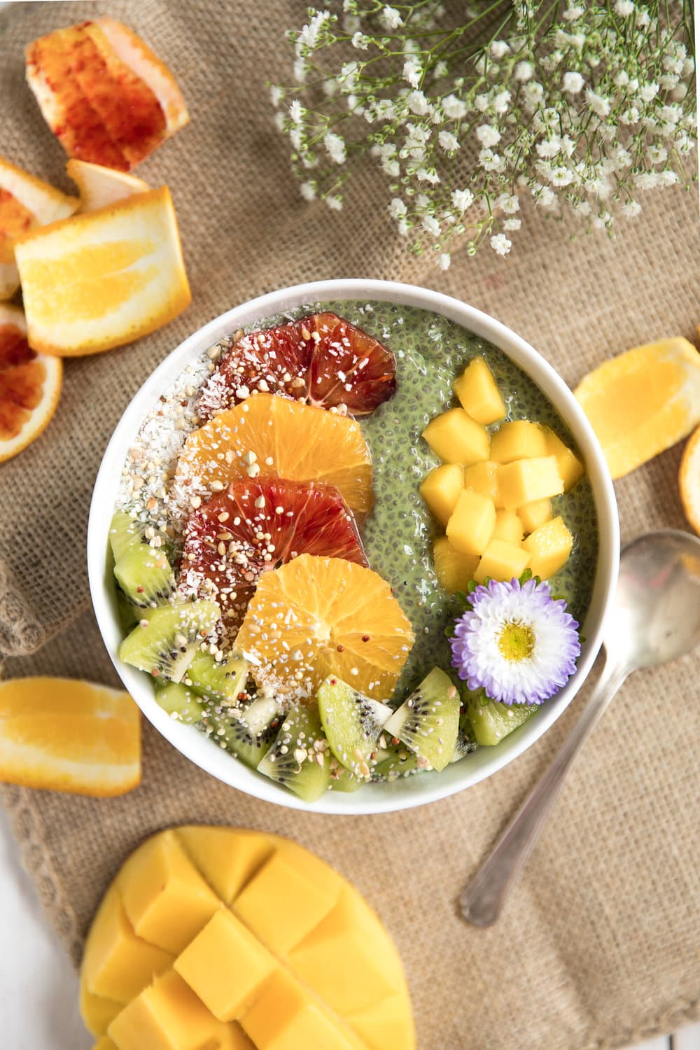 A bowl of fruit in matcha chia pudding